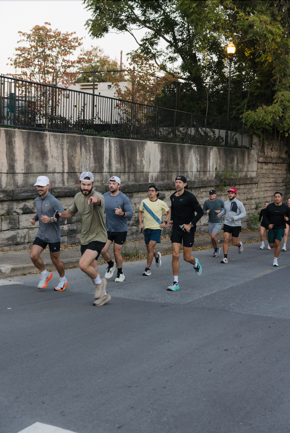 A group of men running on a street during a morning jog.