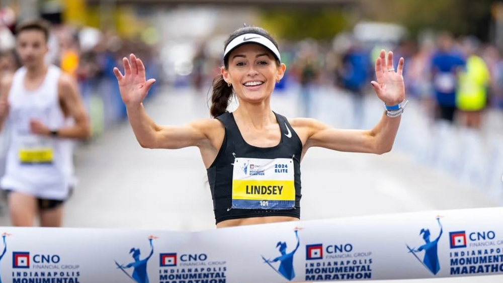Runner Lindsey crossing the finish line at the Indianapolis Marathon
